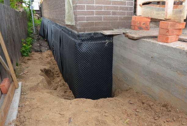 Happy homeowners after waterproofing job in Heath
